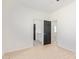 Bright bedroom featuring sleek wood-look flooring, and a bathroom with a modern vanity at 463 W Taylor Ave, Coolidge, AZ 85128