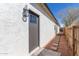 Exterior door with stepping stones surrounded by desert landscaping, adding charm to the property at 463 W Taylor Ave, Coolidge, AZ 85128