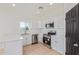 Modern kitchen featuring white cabinets, stainless steel appliances, and plenty of counter space at 463 W Taylor Ave, Coolidge, AZ 85128