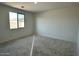 This bedroom offers natural light and a neutral palette perfect for personalizing at 5628 W Summerside Rd, Laveen, AZ 85339