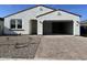 Charming single-story home with a spacious two-car garage and manicured front yard at 5628 W Summerside Rd, Laveen, AZ 85339