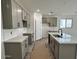 Modern kitchen with stylish grey cabinets, sleek countertops, and stainless steel sink at 5628 W Summerside Rd, Laveen, AZ 85339