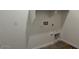 Laundry room with utility hookups, overhead shelf, and tiled flooring at 5628 W Summerside Rd, Laveen, AZ 85339