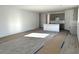 Open living space showcasing a modern kitchen, tile floors, and natural light at 5628 W Summerside Rd, Laveen, AZ 85339
