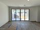Spacious living area featuring sliding glass doors leading to the outdoor patio at 5628 W Summerside Rd, Laveen, AZ 85339