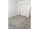 Cozy bedroom featuring plush carpet, white walls, and a closet at 5987 N 48Th Dr, Glendale, AZ 85301