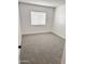 Well-lit bedroom with plush carpet, white walls, and ample natural light at 5987 N 48Th Dr, Glendale, AZ 85301