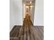 Hallway features clean white walls and modern wood-look vinyl flooring at 5987 N 48Th Dr, Glendale, AZ 85301