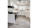 Modern kitchen with stainless appliances, white cabinets, and geometric tile backsplash at 5987 N 48Th Dr, Glendale, AZ 85301