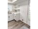 Modern kitchen featuring white cabinets, light countertops, and a view of the patio at 5987 N 48Th Dr, Glendale, AZ 85301