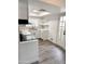 Well-lit kitchen featuring modern appliances, white cabinetry, and a bright atmosphere at 5987 N 48Th Dr, Glendale, AZ 85301