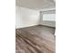 Spacious living room with new floors, white walls and trim, and bright natural light at 5987 N 48Th Dr, Glendale, AZ 85301