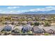 Lush desert neighborhood with beautiful single Gathering homes and a view of distant mountains at 7038 W Beverly Rd, Laveen, AZ 85339