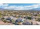 Lush desert neighborhood with beautiful single Gathering homes and a view of distant mountains at 7038 W Beverly Rd, Laveen, AZ 85339