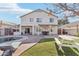 Backyard featuring a pool, covered patio, lounge chairs, picnic table, and grass area at 7038 W Beverly Rd, Laveen, AZ 85339