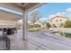 Spacious backyard with covered patio, pool, grass, and mature landscaping for outdoor enjoyment at 7038 W Beverly Rd, Laveen, AZ 85339