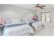 Bedroom with two beds, a ceiling fan, and walk in closet at 7038 W Beverly Rd, Laveen, AZ 85339