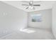 Neutral bedroom boasts carpet, neutral walls, and a large window with blinds offering natural light at 7038 W Beverly Rd, Laveen, AZ 85339