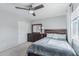 Comfortable bedroom featuring neutral walls, carpet, natural light, and a dark wood bedroom set at 7038 W Beverly Rd, Laveen, AZ 85339