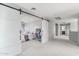 Hallway with white sliding doors leading into a carpeted room at 7038 W Beverly Rd, Laveen, AZ 85339