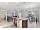 Spacious kitchen with granite countertops, stainless steel appliances, and a functional center island at 7038 W Beverly Rd, Laveen, AZ 85339