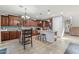 Gourmet kitchen features granite counters, dark wood cabinets, a center island and stainless steel appliances at 7038 W Beverly Rd, Laveen, AZ 85339
