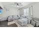 Bright living room with soft gray sectional sofa and plush rug at 7038 W Beverly Rd, Laveen, AZ 85339