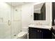 Beautiful bathroom with white cabinets, gold hardware, and a glass-enclosed shower at 7175 E Camelback Rd # 401, Scottsdale, AZ 85251