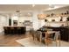 Bright dining area features an elegant woven pendant light and built-in bar with open shelving at 7175 E Camelback Rd # 401, Scottsdale, AZ 85251