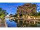 Waterfront building exterior with lush landscaping and beautiful water features at 7175 E Camelback Rd # 401, Scottsdale, AZ 85251