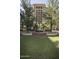 Well-maintained lawn area with mature trees and landscaping, offering a serene and inviting atmosphere at 7175 E Camelback Rd # 401, Scottsdale, AZ 85251