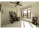 Bright home office with lots of natural light, a ceiling fan, and neutral color scheme at 7175 E Camelback Rd # 401, Scottsdale, AZ 85251