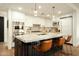 Spacious kitchen with stainless appliances, marble counters, custom cabinets and a large center island at 7175 E Camelback Rd # 401, Scottsdale, AZ 85251
