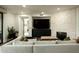 Comfortable living room area showcases modern decor, a stone accent wall with fireplace, and recessed lighting at 7175 E Camelback Rd # 401, Scottsdale, AZ 85251