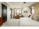 Bright main bedroom featuring a cozy seating area by the window, complemented by neutral tones at 7175 E Camelback Rd # 401, Scottsdale, AZ 85251