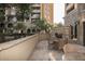 Beautiful outdoor patio featuring a stone fireplace and comfortable wicker seating, perfect for relaxation at 7175 E Camelback Rd # 401, Scottsdale, AZ 85251