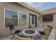 Backyard with a patio, outdoor seating, and an outdoor fire pit area at 7252 E Nido Ave, Mesa, AZ 85209