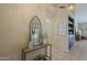 Nicely decorated entryway featuring an ornate mirror, a console table, and a stylish accent basket at 7252 E Nido Ave, Mesa, AZ 85209