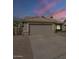 Charming single-story home with a two-car garage and beautifully maintained desert landscaping at 7252 E Nido Ave, Mesa, AZ 85209