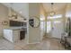 Open-concept foyer showcasing modern lighting, high ceilings, and neutral color palette at 7252 E Nido Ave, Mesa, AZ 85209
