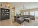 Spacious living room with vaulted ceilings, a plush sectional, and stylish decor at 7252 E Nido Ave, Mesa, AZ 85209