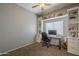 Office features built-in shelving, a desk area, neutral paint, and carpeted floor at 7252 E Nido Ave, Mesa, AZ 85209