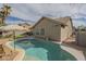Inviting pool area with lush landscaping, patio, and backyard view at 7252 E Nido Ave, Mesa, AZ 85209