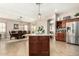 Open kitchen and dining area with a view of the backyard at 9455 W Melinda Ln, Peoria, AZ 85382