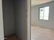 Unfinished bedroom with walk in closet and a window at 9613 W Parkway Dr, Tolleson, AZ 85353