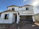 A two-story home in progress, showing its structural framework and design during the construction phase at 9613 W Parkway Dr, Tolleson, AZ 85353