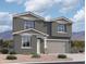 Charming two-story home featuring a two-car garage, neutral stucco, and a meticulously landscaped front yard at 9613 W Parkway Dr, Tolleson, AZ 85353