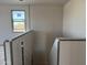 Unfinished hallway featuring a window with natural light at 9613 W Parkway Dr, Tolleson, AZ 85353