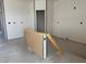 Spacious, unfinished living area with open layout and doorway at 9613 W Parkway Dr, Tolleson, AZ 85353