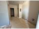 A living room with plywood floors and walls that are ready for paint and customization at 9613 W Parkway Dr, Tolleson, AZ 85353